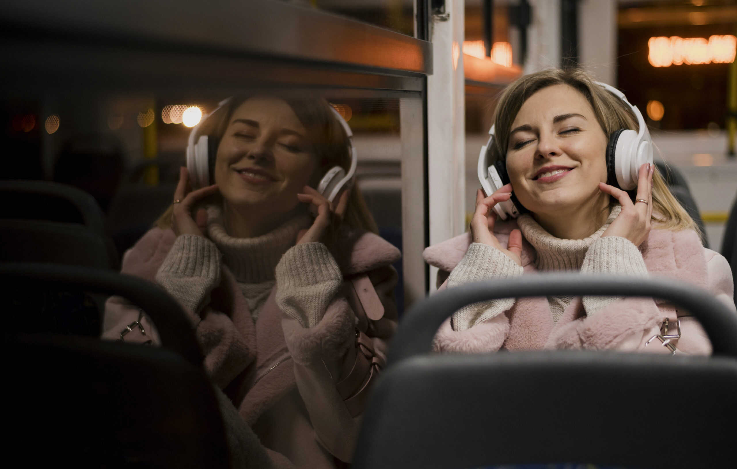 Girl on bus with headphones
