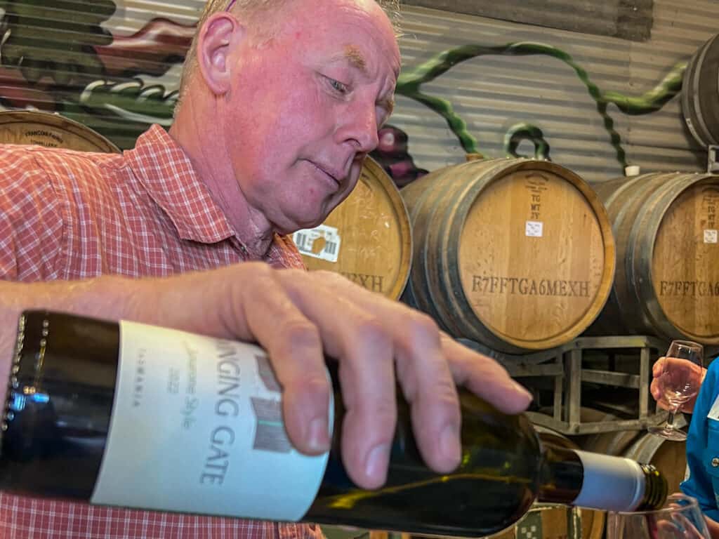 Pouring a glass of wine at the Swinging Door winery