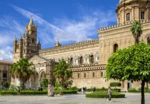 Bright day view of the historic Palermo Cathedral in Sicily, showcasing its impressive architectural details.