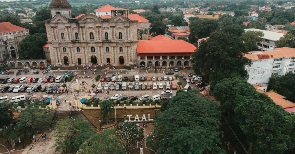 Stunning aerial view of Taal Basilica and surrounding town in the Philippines, showcasing historic architecture.
