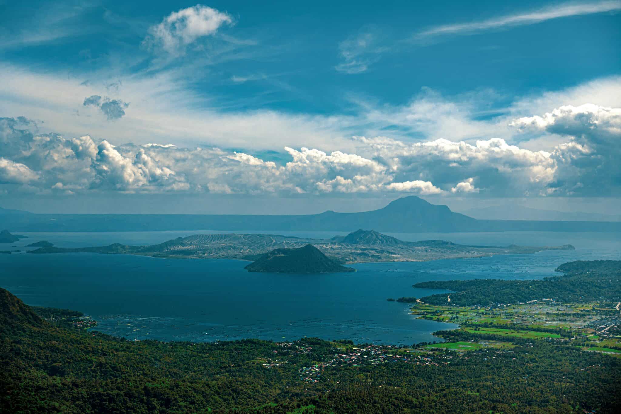 A breathtaking view of Taal Lake and Volcano in Tagaytay, Philippines under a clear blue sky.