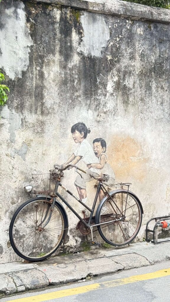 penang street art, armenia street, little chidren on bicycle mural
