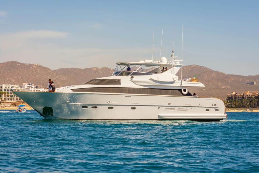 Experience the elegance of a luxury yacht sailing along the scenic coast of Cabo San Lucas.