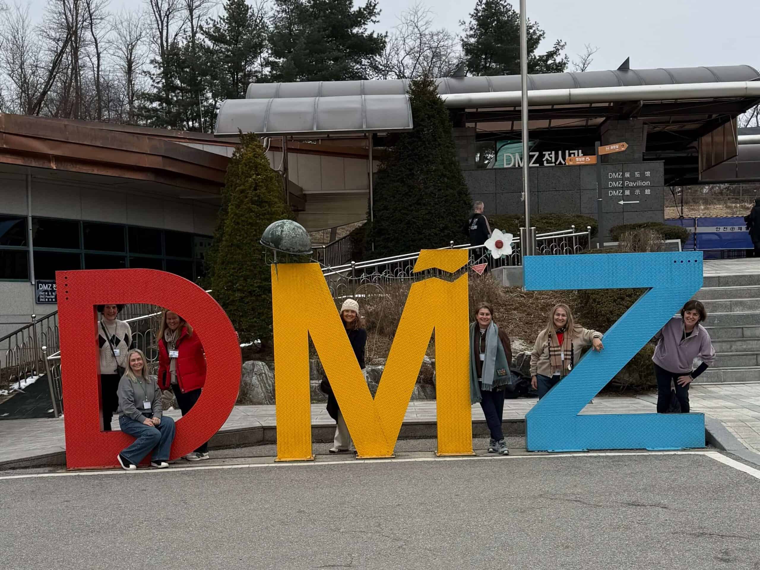 DMZ, DMZ pavillion, standing infront of the DMZ sign