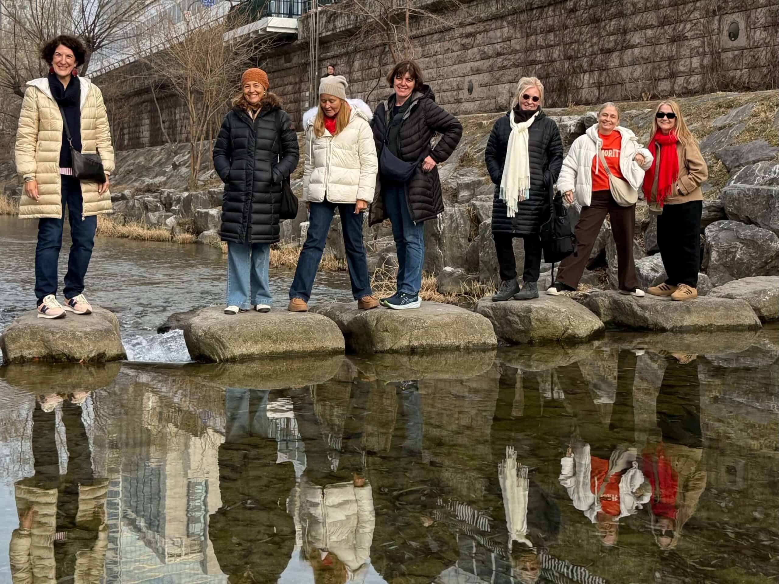 Cheonggyecheon Stream, seoul, urban stream, girls walking across the stream