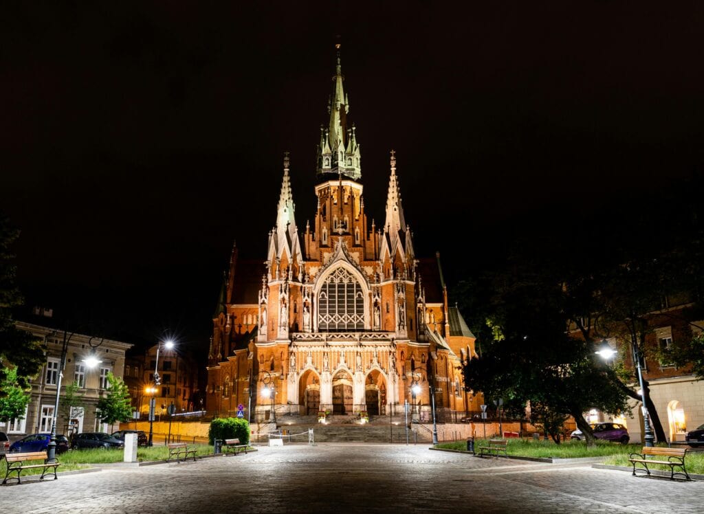 Stunning view of St. Joseph's Church in Krakow, Poland, beautifully illuminated at night.