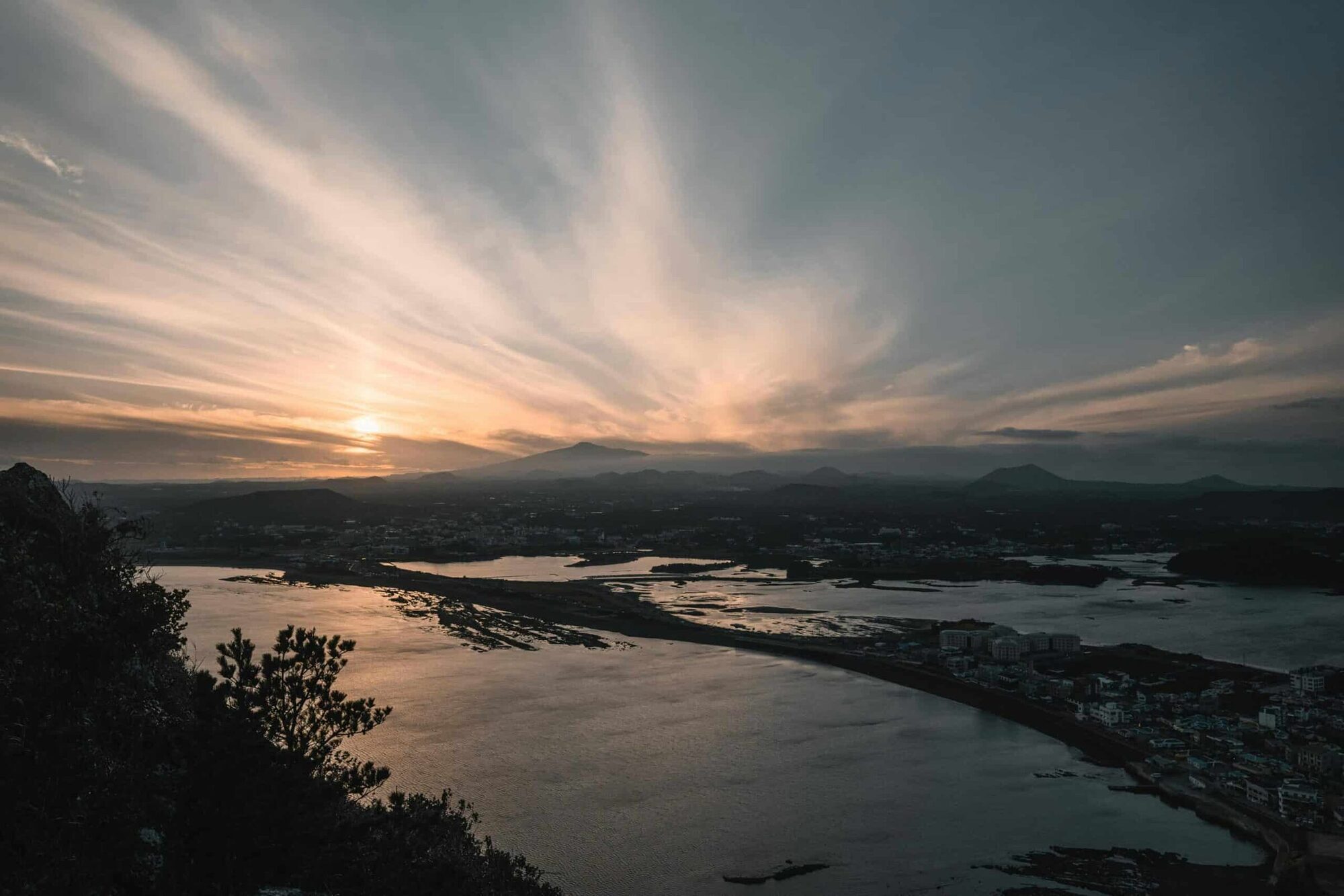 pexels-photo-6476882-6476882 Captivating sunrise view over Seongsan, Jeju Island with striking seascape and clouds.