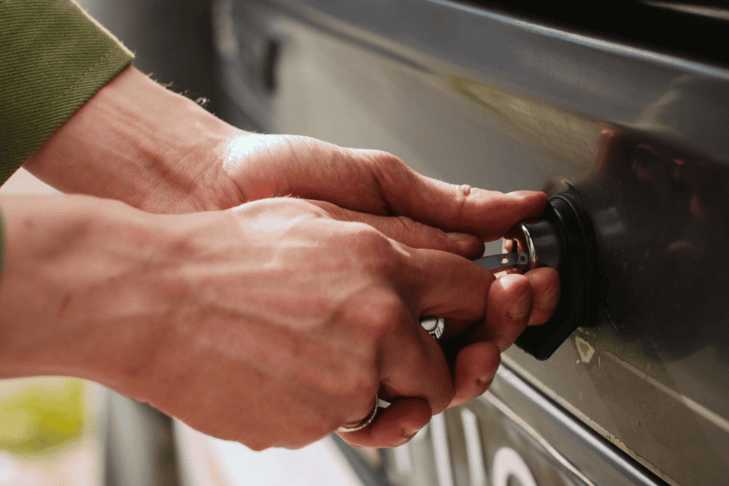 hands unlocking a car door