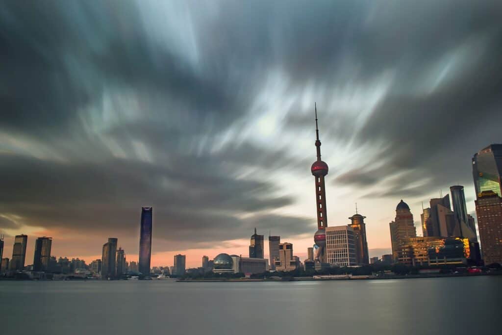 Stunning view of Shanghai skyline at dusk with the iconic Oriental Pearl Tower prominently featured.
