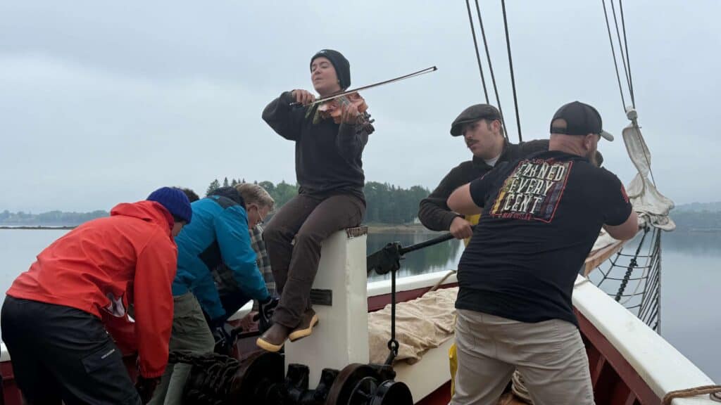 music playing on the riggin while the crew works