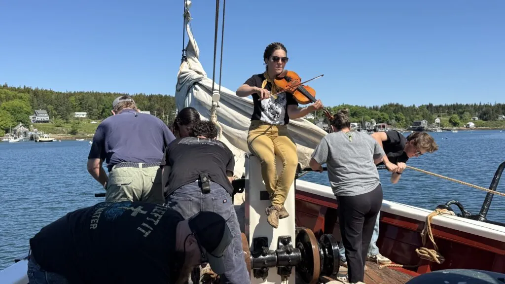 J and E Riggin - working on board with music